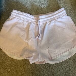 Pale pink Aritzia sweatshorts